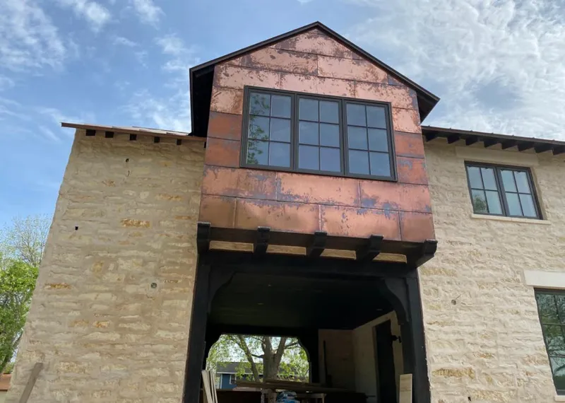 Copper metal panel facade on a stone building for Metal Roof Coating in Sevierville